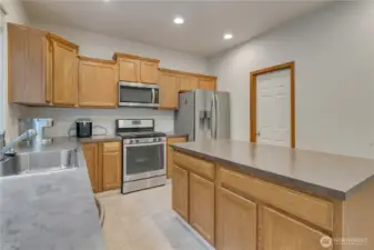 Kitchen with door leading to the walk-in pantry.
