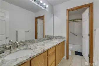 Upstairs Full Bathroom with double sinks & granite counters.