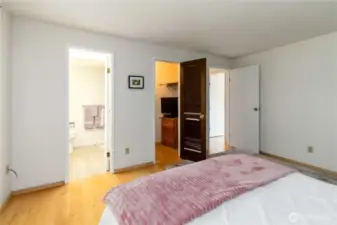 Convenient primary layout with direct access to a full bathroom and closet space.