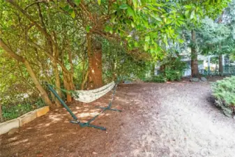 This backyard offers so much versatility for lounging, gardening, or enjoying quiet moments surrounded by nature.