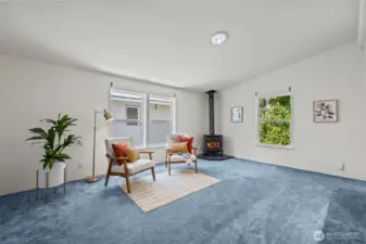 Family room with cozy propane stove.