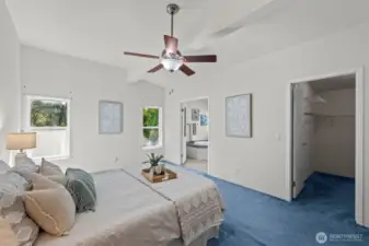 Primary bedroom is light-filled and features a huge walk-in closet.
