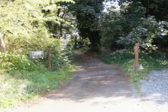 2nd Driveway that leads to detached shop and makes a complete loop around the property.