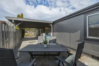 Spacious carport, plus a patio and a storage shed.