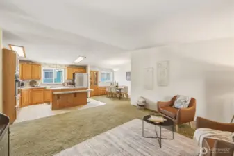 Looking at the kitchen and the dining space to the right with oak built-ins!
