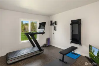 The fourth bedroom has been transformed into a private, fully equipped fitness studio.