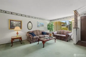 Front room with plenty of space and a large window.