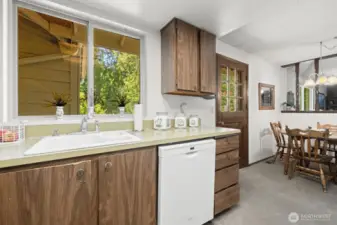 Kitchen has view of the private backyard.
