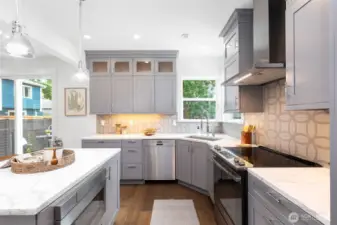 Quartz counters, tile backsplash, and lots of room for sous chefs to help.