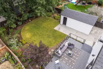 Lush backyard gets lots of natural light and is a gardener's paradise!
