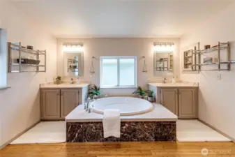Dual vanities and large soaking tub.