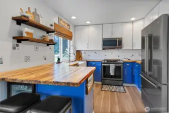 Contemporary floating shelves and backsplash in kitchen