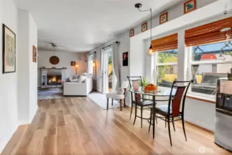 Looking into family room from kitchen area.  Great view of cozy fireplace.