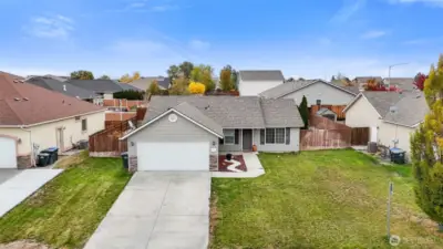 Attractive exterior featuring gray siding complemented by elegant stack -rock accents along front of the garage.