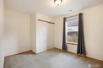 Bedroom #2 has views of side back yard and spacious closet.
