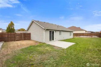 Large fully fenced backyard with patio slab and dual gates - private and ready for outdoor fun!