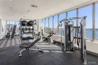 41st floor fitness center inlcludes things often not found in multi-family gyms; Smith machine for squatting and pressing without spots and free weights for bench work.