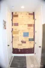 decorative wall next to pantry and garage entry