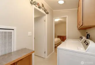 Spacious laundry area off the primary bedroom.