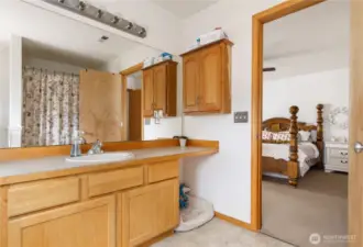 Looking back into primary bedroom from bathroom.