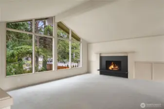 Vaulted ceilings, oversized windows, new carpet, wood burning fireplace