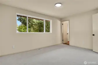 Primary bedroom on upper level with full en-suite bathroom