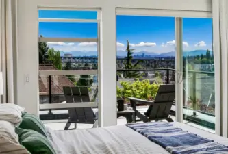 Dreamy primary suite level with view deck facing East. Imagine the great morning light!