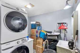 Excuse us as we are moving! The laundry room, behind the barn door, has a half bath too.