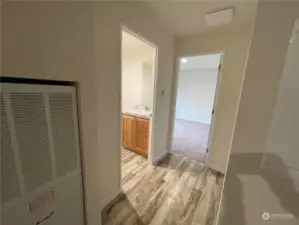 Back hallway with bathroom and Primary bedroom