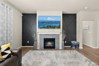 An elevated living space with stunning design features that flank the gas fireplace and media area, creating a focal point of modern elegance. These cool design elements not only enhance the visual appeal but also provide a chic backdrop for relaxation and entertainment.