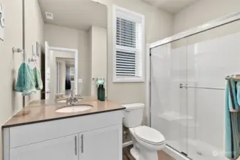 This home features a convenient 3/4 bath with a walk-in shower, ideally located close to the guest suite. This thoughtful design ensures ease of access for visitors, enhancing both comfort and privacy.