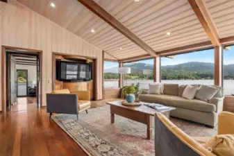 Looking across the living room to the primary bedroom suite.