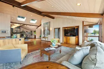 Looking across the living room toward the informal dining area with the sitting room and office niche beyond.