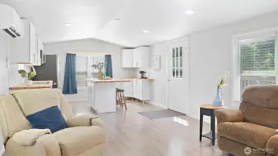 With tall ceilings, sleek recessed lighting, and beautiful laminate floors, this space feels open, modern, and totally welcoming.