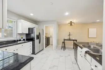 Newer Luxury vinyl flooring throughout kitchen and laundry room