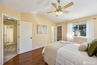 Primary bedroom with lots of natural lighting, overhead fan on remote.