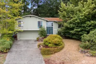 This home is ready for a fresh vision! Tucked away on a quiet street, surrounded by nature.