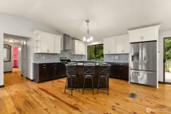 Updated kitchen opens to main living space, making everyday living and entertaining easy.