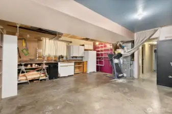 Garage space.  Not photographed: a wall was added in front of garage door so space cannot be used as garage as-is. Wall could be removed and converted back to garage.