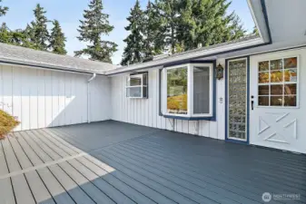 Newly surfaced front deck with trex decking
