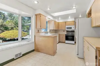 Generous sized kitchen with eating space and plenty of cabinets