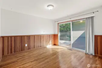Real wood clad walls and real hardwood floors with slider to the back yard