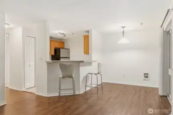 Kitchen island with seating, connecting to the living and dining room.