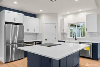 The large island provides hidden storage underneath. Comfortably seats six people.