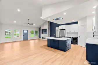 Another view of the main living room looking towards the front door. The two guest bedrooms and bathroom are to the left, primary suite and laundry are to the right.
