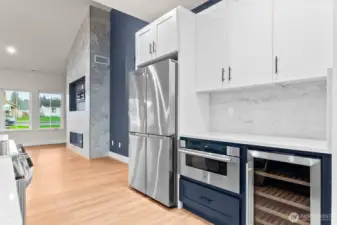 GE beverage center with oak shelves adds both style and functionality for entertaining.