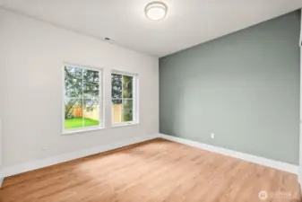 Comfortable guest bedroom with modern finishes and a bright, inviting feel.