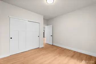 Another view of one of the guest bedrooms. Ample closet space and large windows are an added bonus to both guest bedrooms.