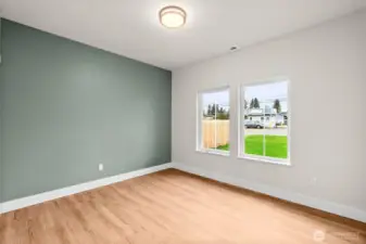 The second guest bedroom that faces the front of the home. Insulated interior walls sound proof the home.