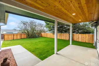 Inviting covered back porch—perfect for relaxing, entertaining, and enjoying the outdoors year round.